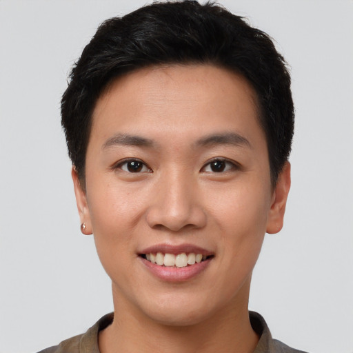 Joyful asian young-adult female with short  brown hair and brown eyes