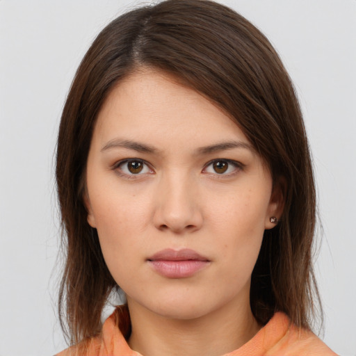 Neutral white young-adult female with medium  brown hair and brown eyes