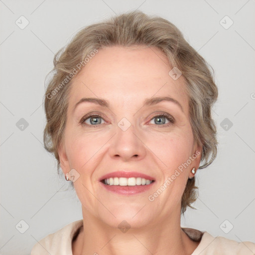 Joyful white adult female with medium  brown hair and blue eyes