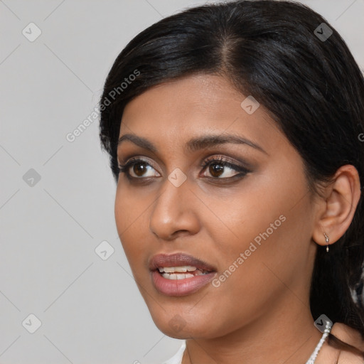 Joyful asian young-adult female with medium  black hair and brown eyes