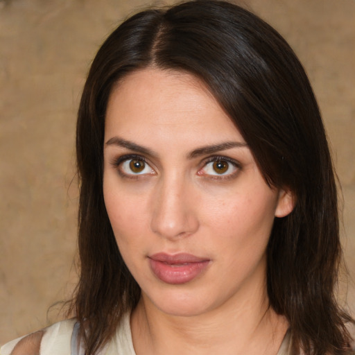 Neutral white young-adult female with medium  brown hair and brown eyes
