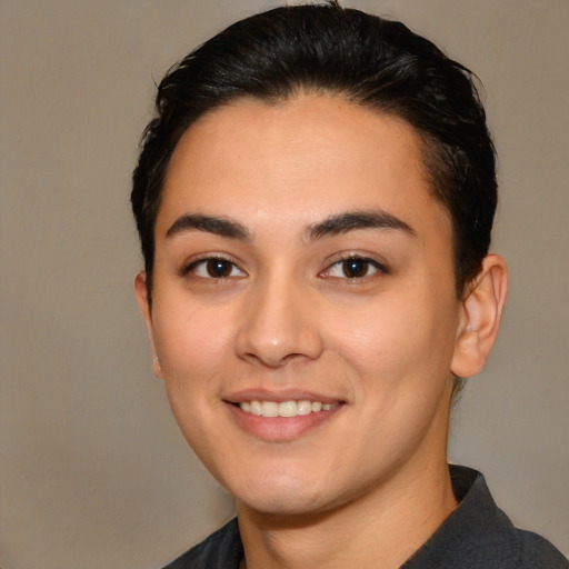 Joyful white young-adult female with short  black hair and brown eyes