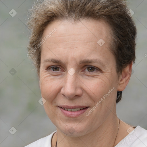 Joyful white adult female with short  brown hair and brown eyes