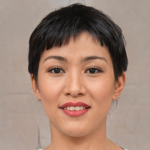 Joyful white young-adult female with short  black hair and brown eyes