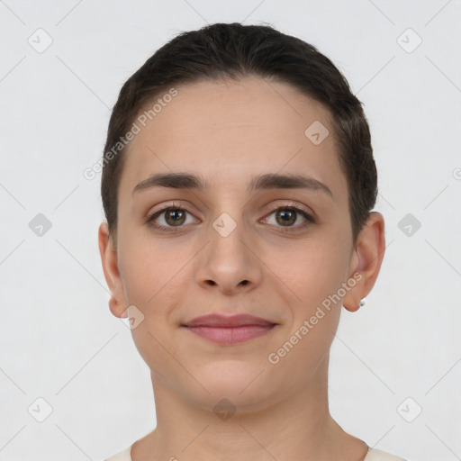 Joyful white young-adult female with short  brown hair and brown eyes