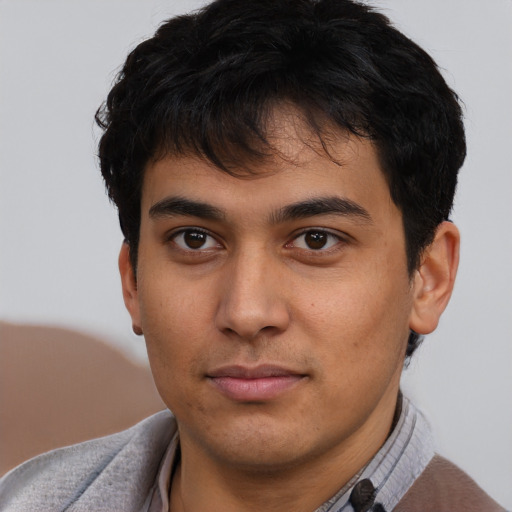 Neutral latino young-adult male with short  brown hair and brown eyes