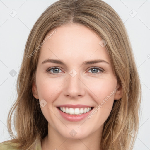 Joyful white young-adult female with medium  brown hair and green eyes