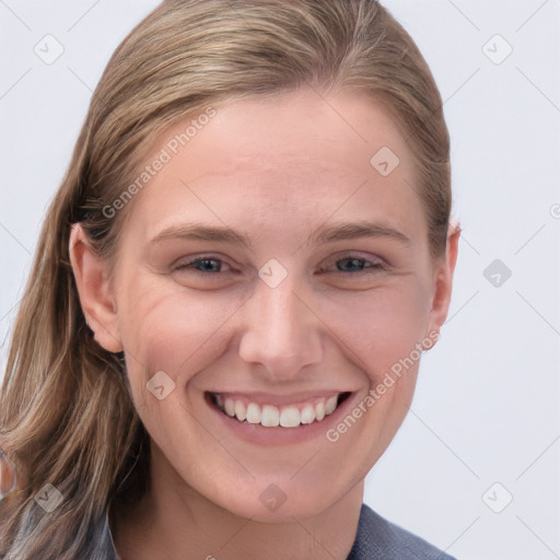 Joyful white young-adult female with long  brown hair and blue eyes