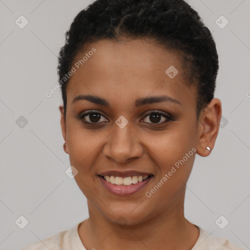 Joyful black young-adult female with short  brown hair and brown eyes