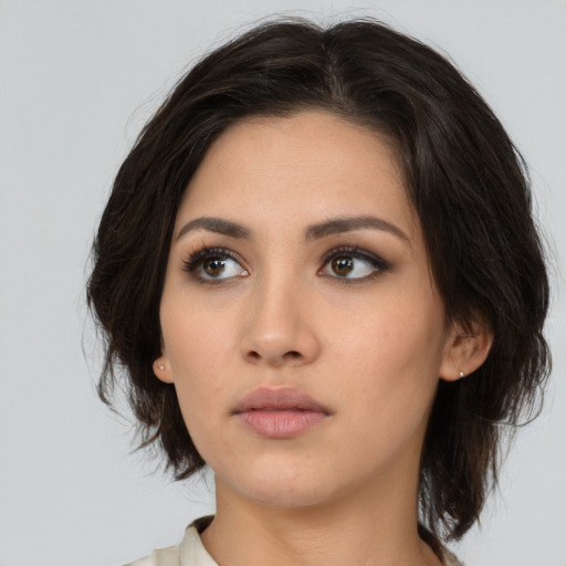 Neutral white young-adult female with medium  brown hair and brown eyes