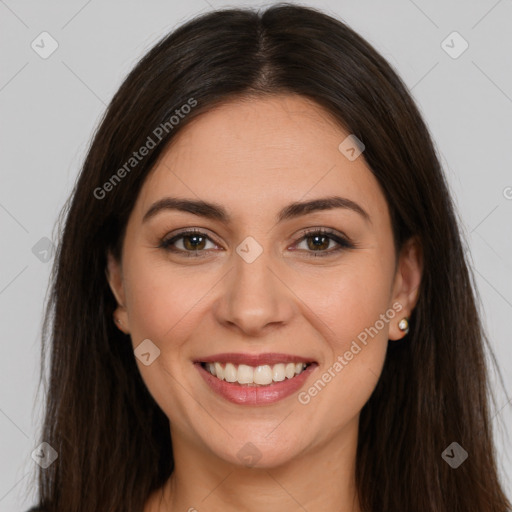 Joyful white young-adult female with long  brown hair and brown eyes