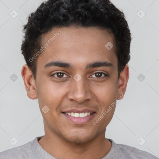 Joyful latino young-adult male with short  brown hair and brown eyes