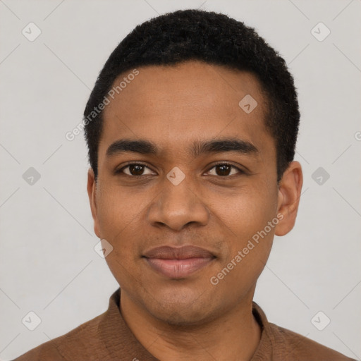 Joyful black young-adult male with short  black hair and brown eyes