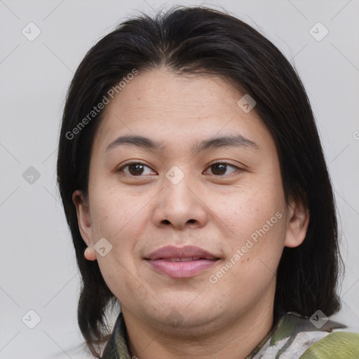 Joyful asian young-adult female with medium  brown hair and brown eyes