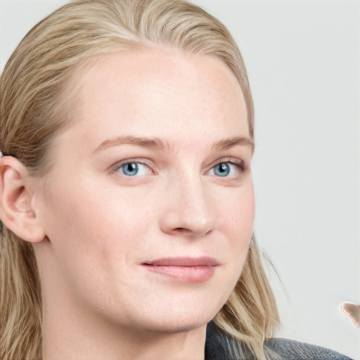 Joyful white young-adult female with long  brown hair and blue eyes