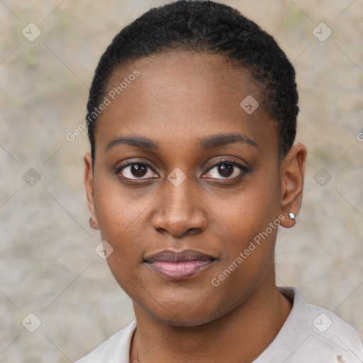 Joyful black young-adult female with short  black hair and brown eyes