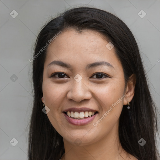 Joyful asian young-adult female with long  brown hair and brown eyes