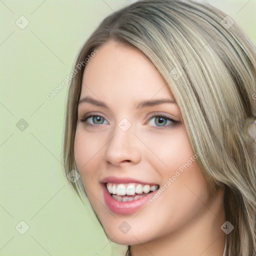 Joyful white young-adult female with long  brown hair and green eyes