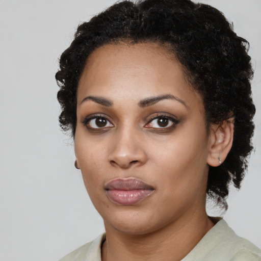Neutral black young-adult female with medium  black hair and brown eyes