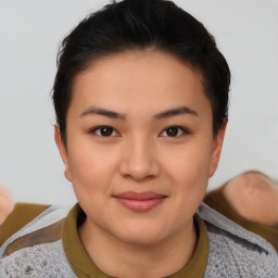 Joyful asian young-adult female with short  black hair and brown eyes