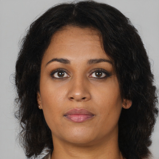 Neutral black young-adult female with medium  brown hair and brown eyes