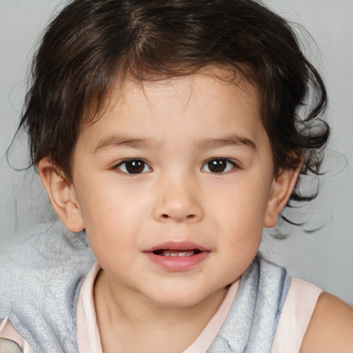 Joyful white child male with medium  brown hair and brown eyes