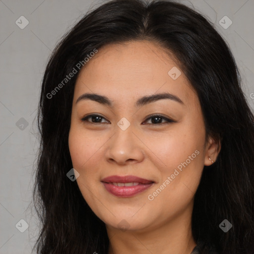 Joyful asian young-adult female with long  brown hair and brown eyes