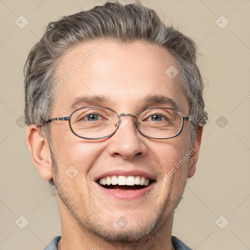 Joyful white adult male with short  brown hair and grey eyes