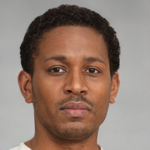 Neutral latino young-adult male with short  brown hair and brown eyes