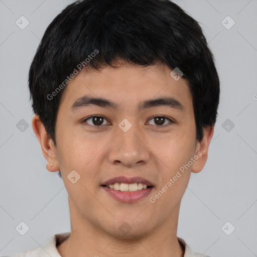 Joyful asian young-adult male with short  brown hair and brown eyes