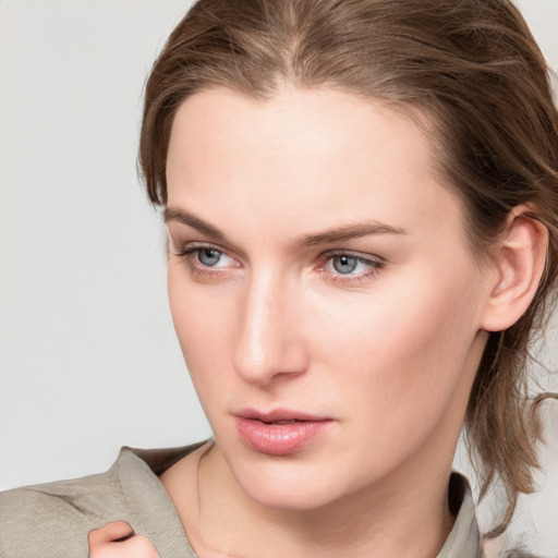 Neutral white young-adult female with medium  brown hair and grey eyes