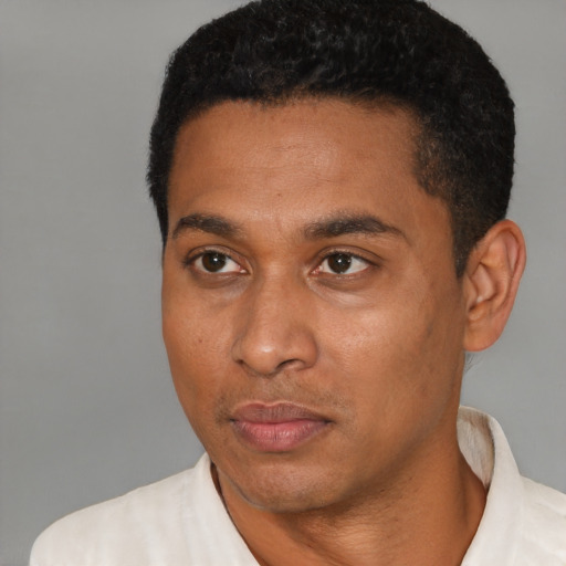 Neutral latino young-adult male with short  black hair and brown eyes