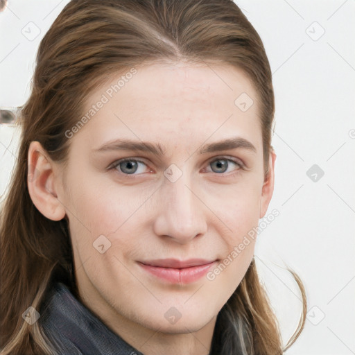 Joyful white young-adult female with long  brown hair and blue eyes