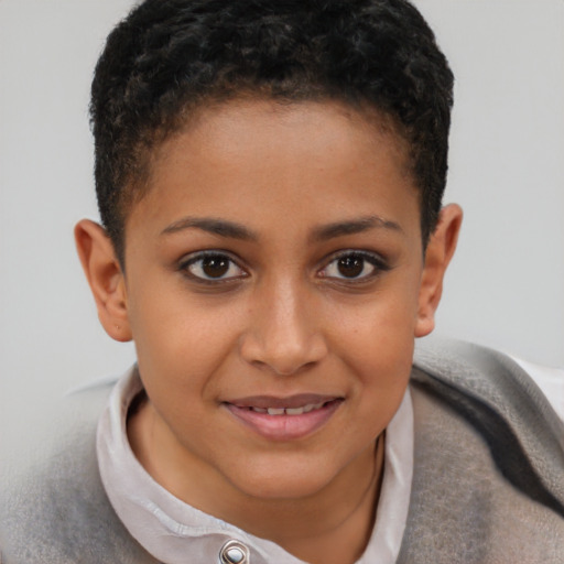 Joyful black child female with short  brown hair and brown eyes