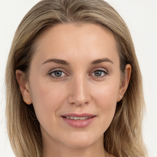 Joyful white young-adult female with long  brown hair and blue eyes