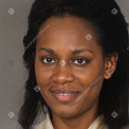 Joyful black young-adult female with long  brown hair and brown eyes