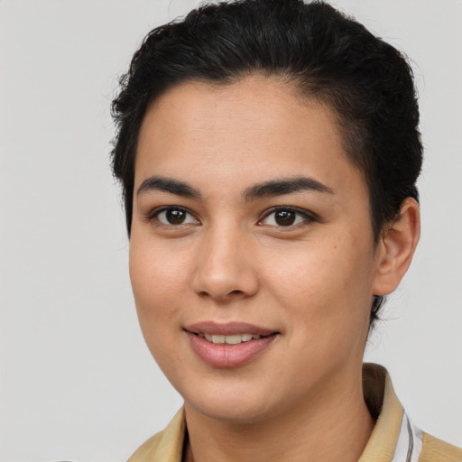 Joyful latino young-adult female with short  brown hair and brown eyes