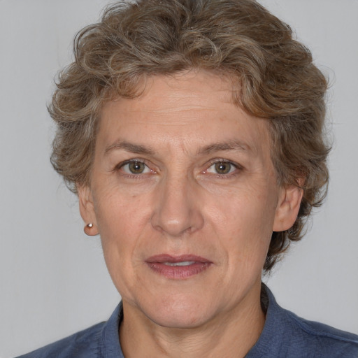 Joyful white middle-aged female with medium  brown hair and brown eyes