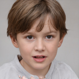 Joyful white child female with short  brown hair and brown eyes