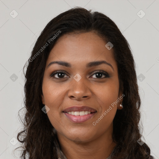 Joyful black young-adult female with long  brown hair and brown eyes