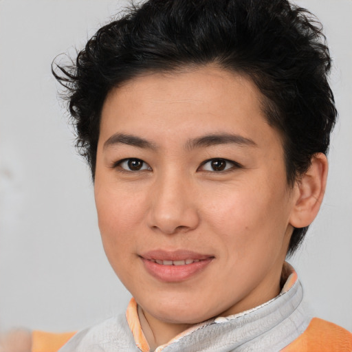 Joyful asian young-adult female with short  brown hair and brown eyes