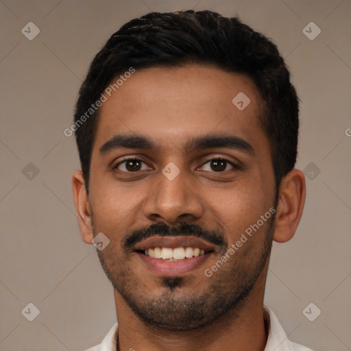 Joyful latino young-adult male with short  black hair and brown eyes