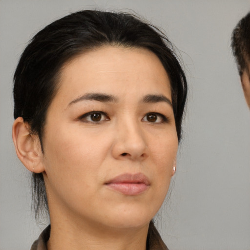 Neutral white young-adult female with short  brown hair and brown eyes