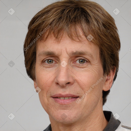 Joyful white adult male with short  brown hair and grey eyes