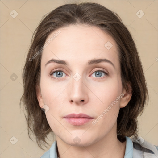 Neutral white young-adult female with medium  brown hair and green eyes