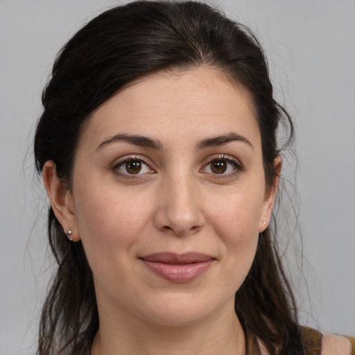 Joyful white young-adult female with medium  brown hair and brown eyes