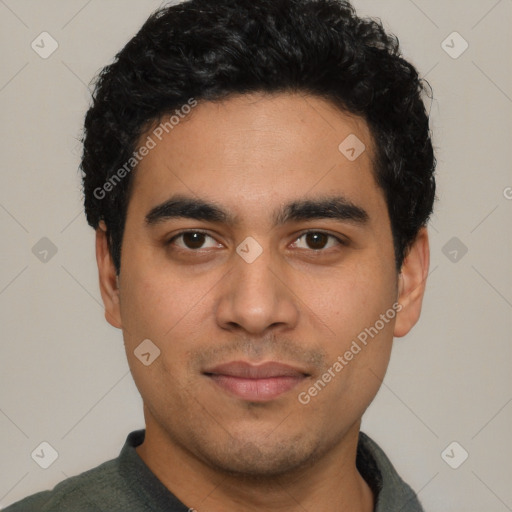 Joyful latino young-adult male with short  black hair and brown eyes