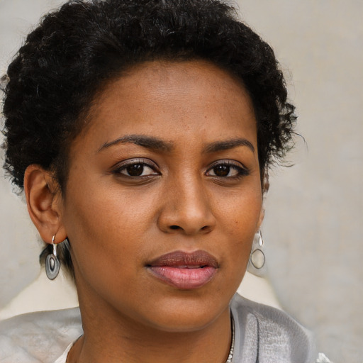 Neutral black young-adult female with short  brown hair and brown eyes