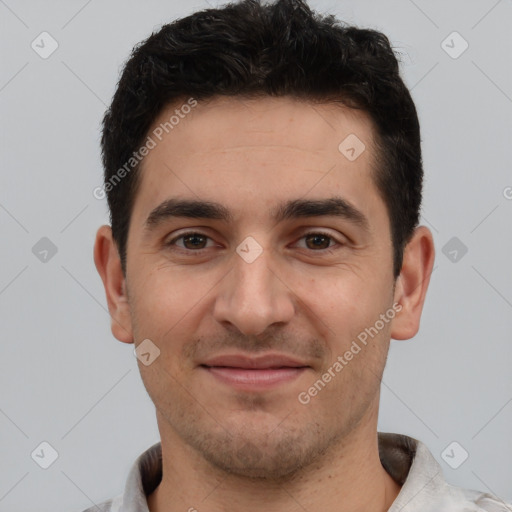 Joyful white young-adult male with short  black hair and brown eyes