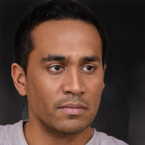 Neutral latino young-adult male with short  brown hair and brown eyes